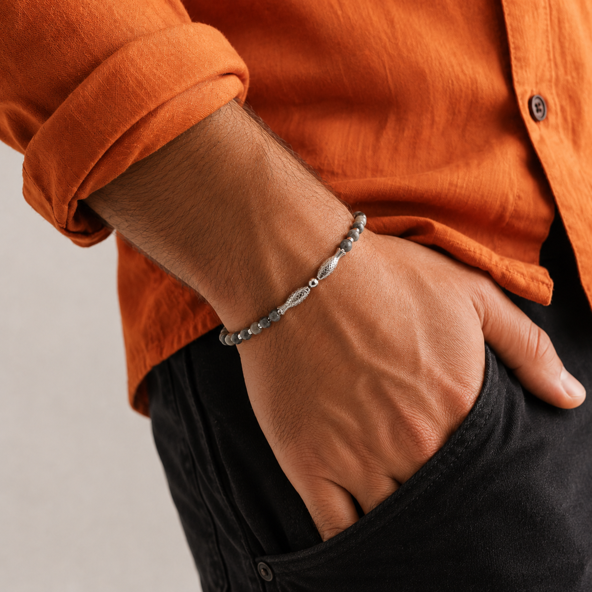 Twin Fish Grey Bracelet for Men by SALVE featuring two silver-tone fish charms on a grey cord.