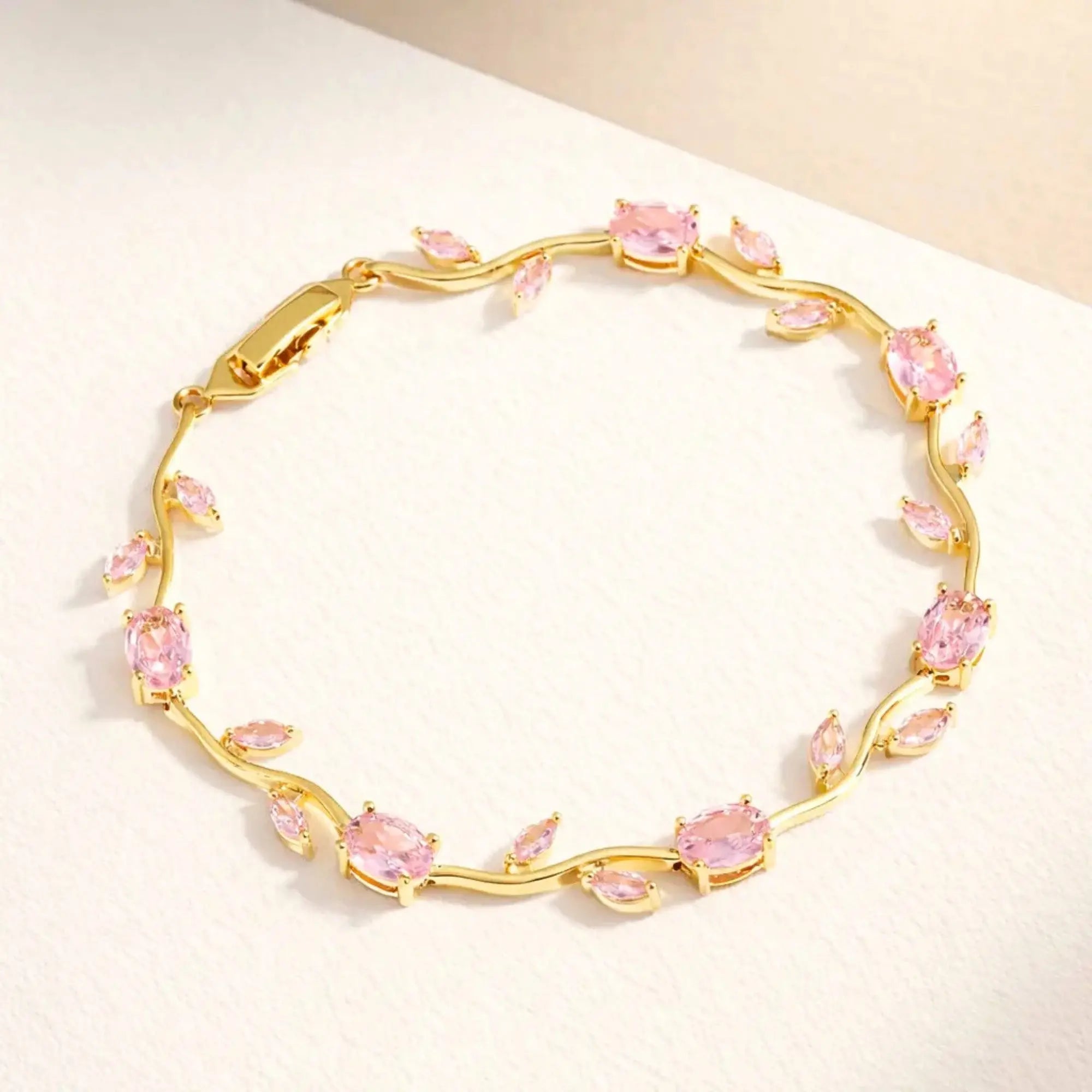 Pink tulip bracelet for women by SALVE, delicate jewelry piece with floral design and adjustable chain.