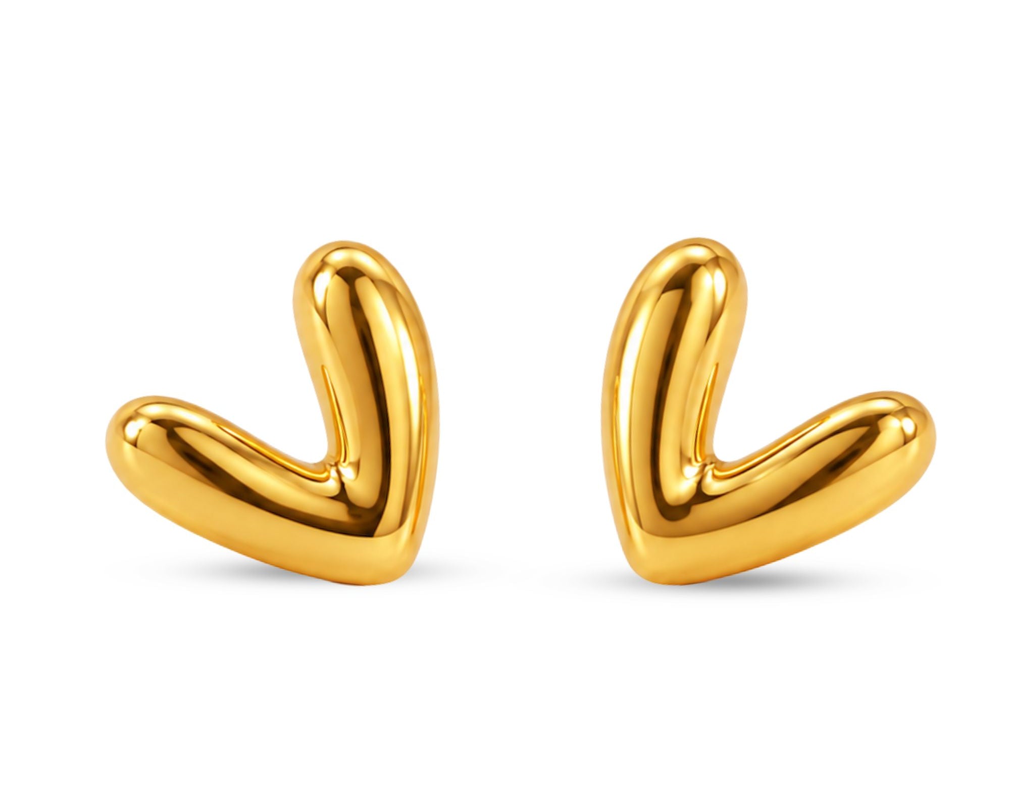 Gold-toned heart earrings from SALVE featuring a delicate design, perfect for adding a romantic touch to any outfit.