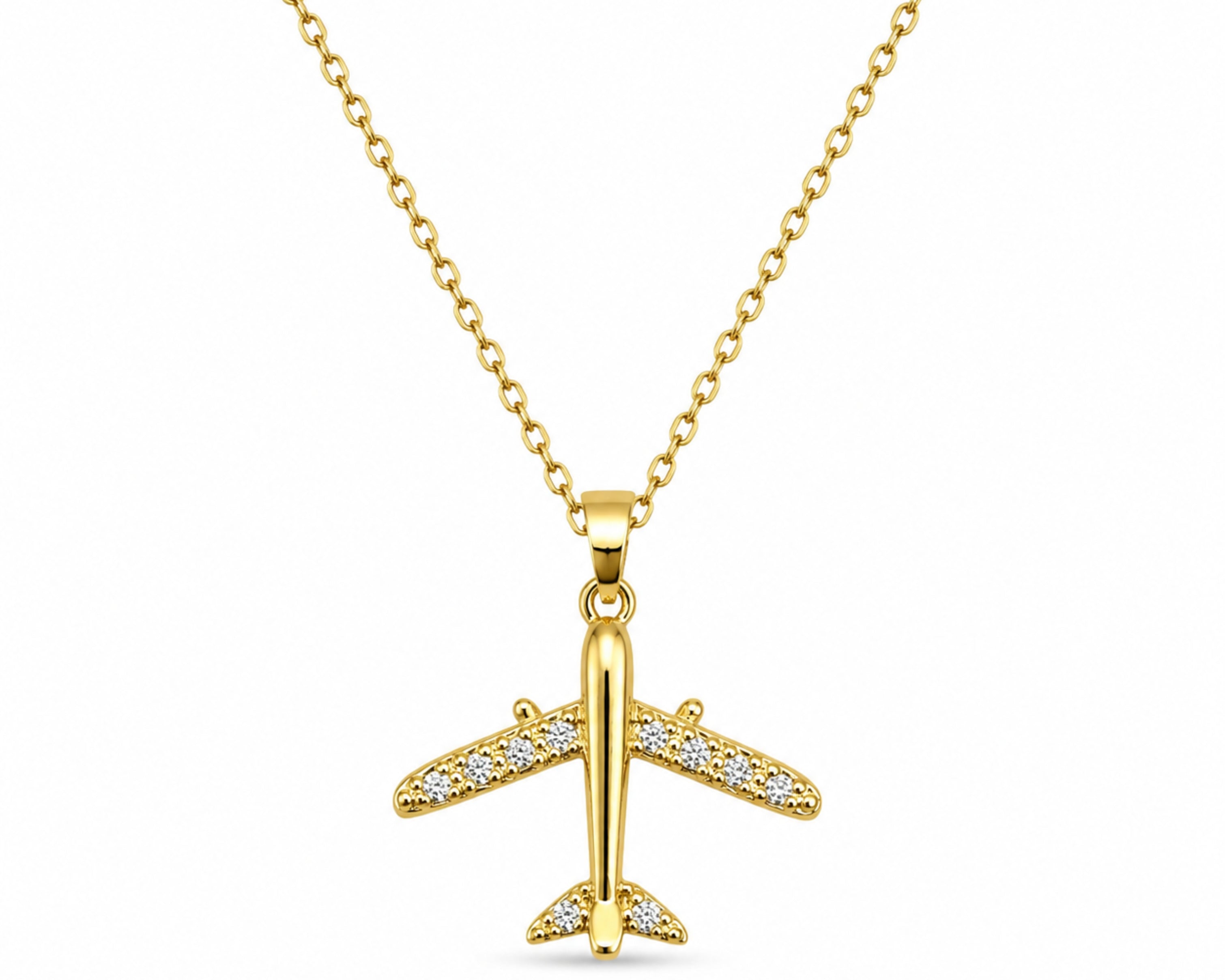 Salve CZ-studded airplane pendant necklace featuring a sleek metal airplane charm with sparkling cubic zirconia accents on a chain.