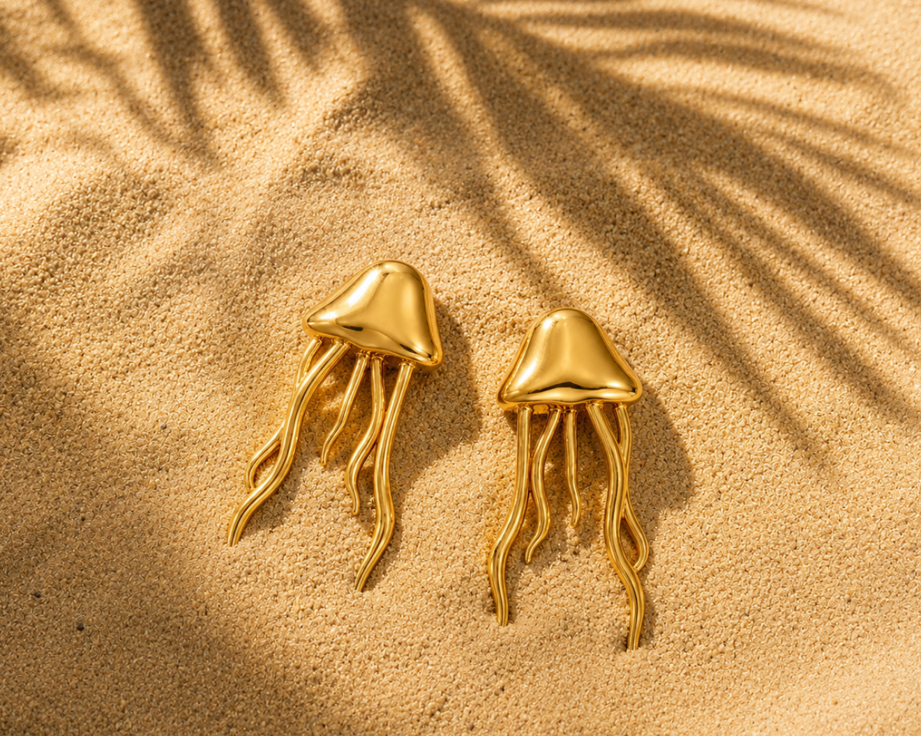 SALVE Jellyfish Beach Gold Earrings featuring delicate jellyfish-shaped design with gold finish, stylish and lightweight accessory.