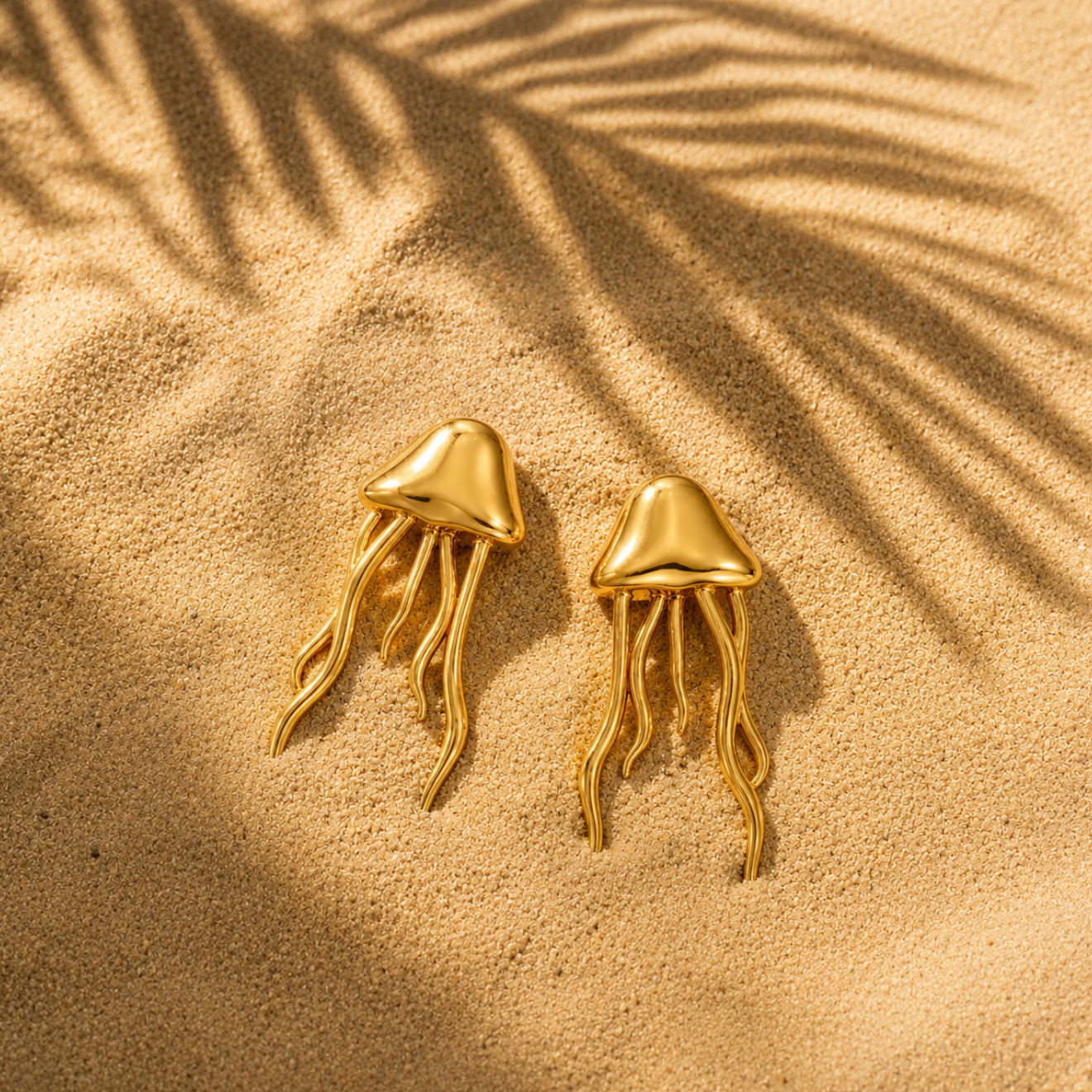 SALVE Jellyfish Beach Gold Earrings featuring delicate jellyfish-shaped design with gold finish, stylish and lightweight accessory.
