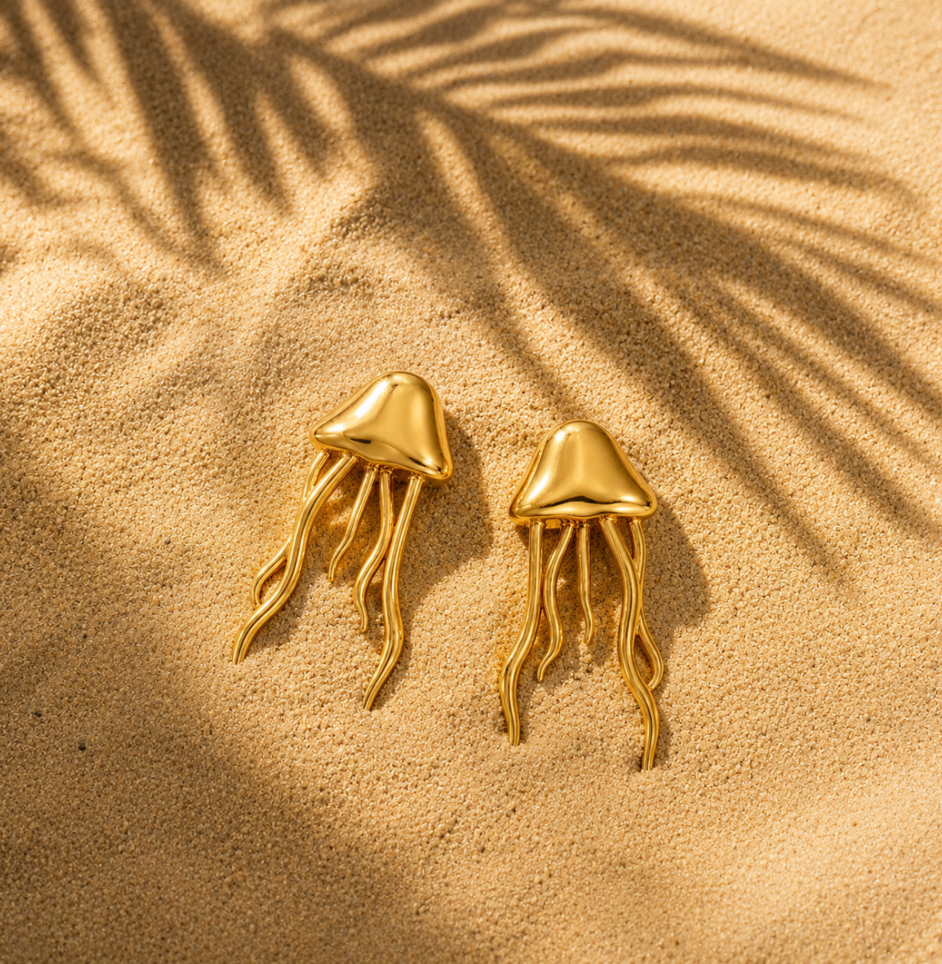 SALVE Jellyfish Beach Gold Earrings featuring delicate jellyfish-shaped design with gold finish, stylish and lightweight accessory.