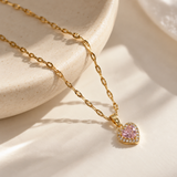 Salve CZ baby pink heart pendant necklace with a sparkling gemstone, showcasing a delicate jewelry design.
