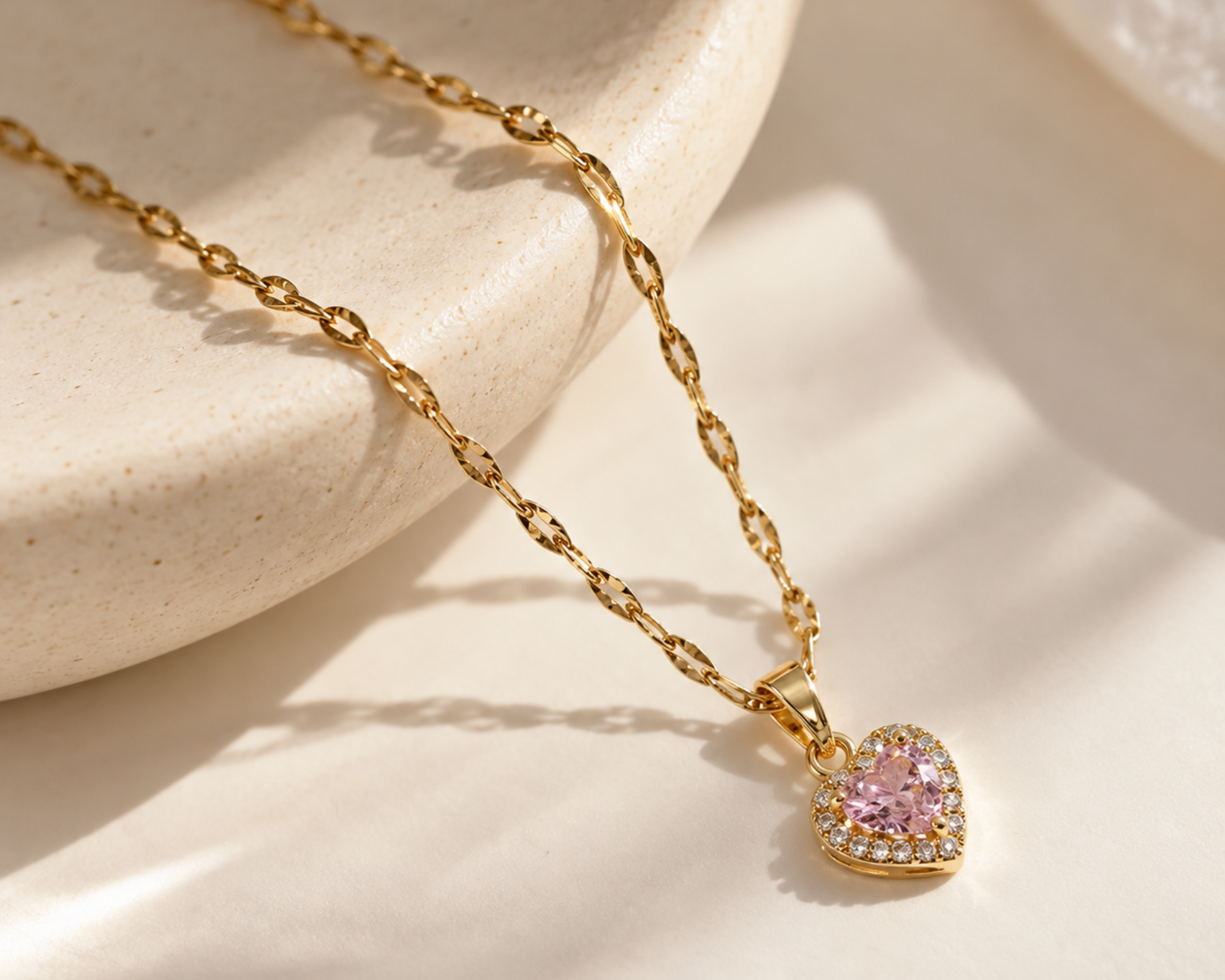 Salve CZ baby pink heart pendant necklace with a sparkling gemstone, showcasing a delicate jewelry design.