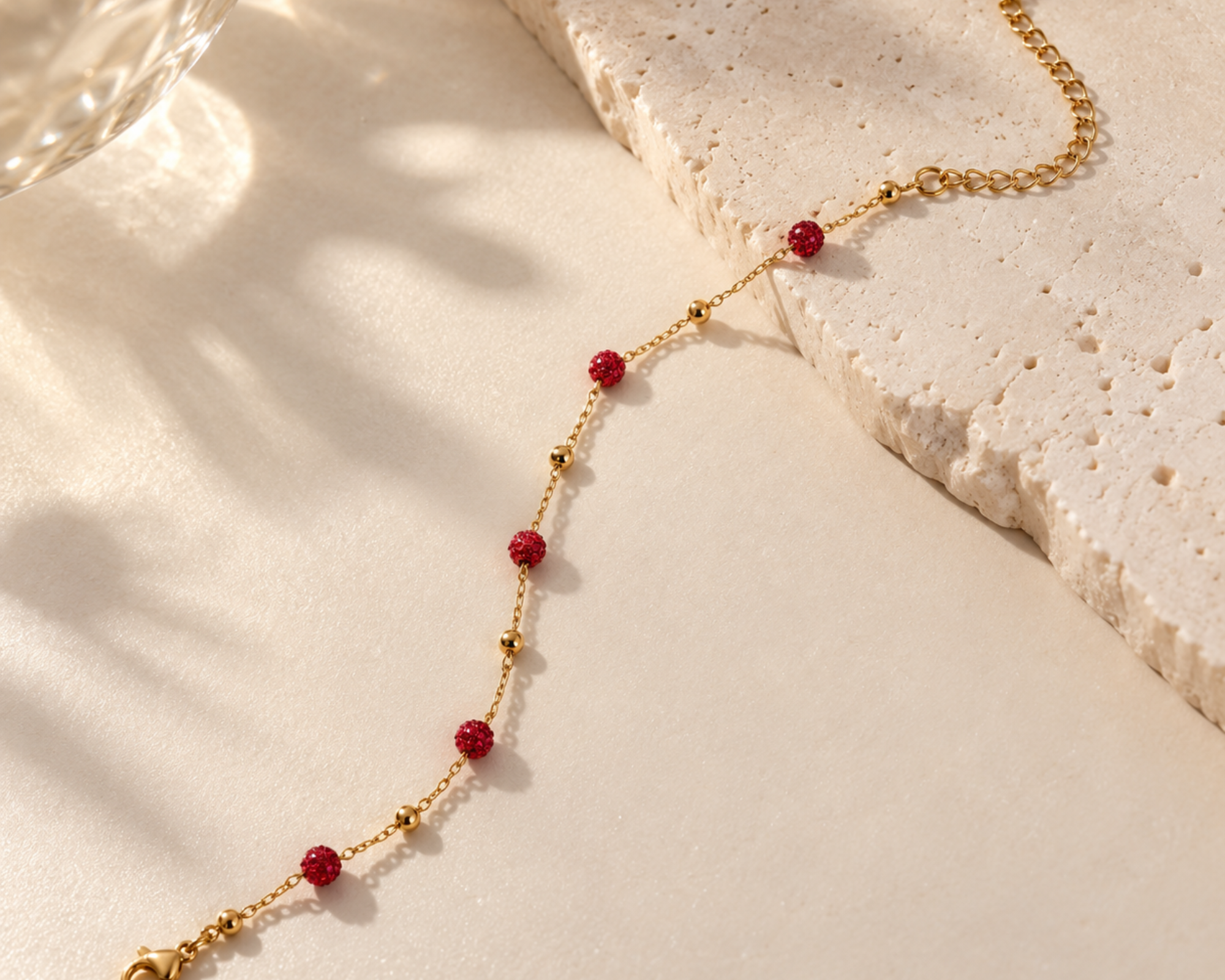 Salve red crystal anti-tarnish bracelet featuring vibrant red crystals and a sleek silver-tone chain design.