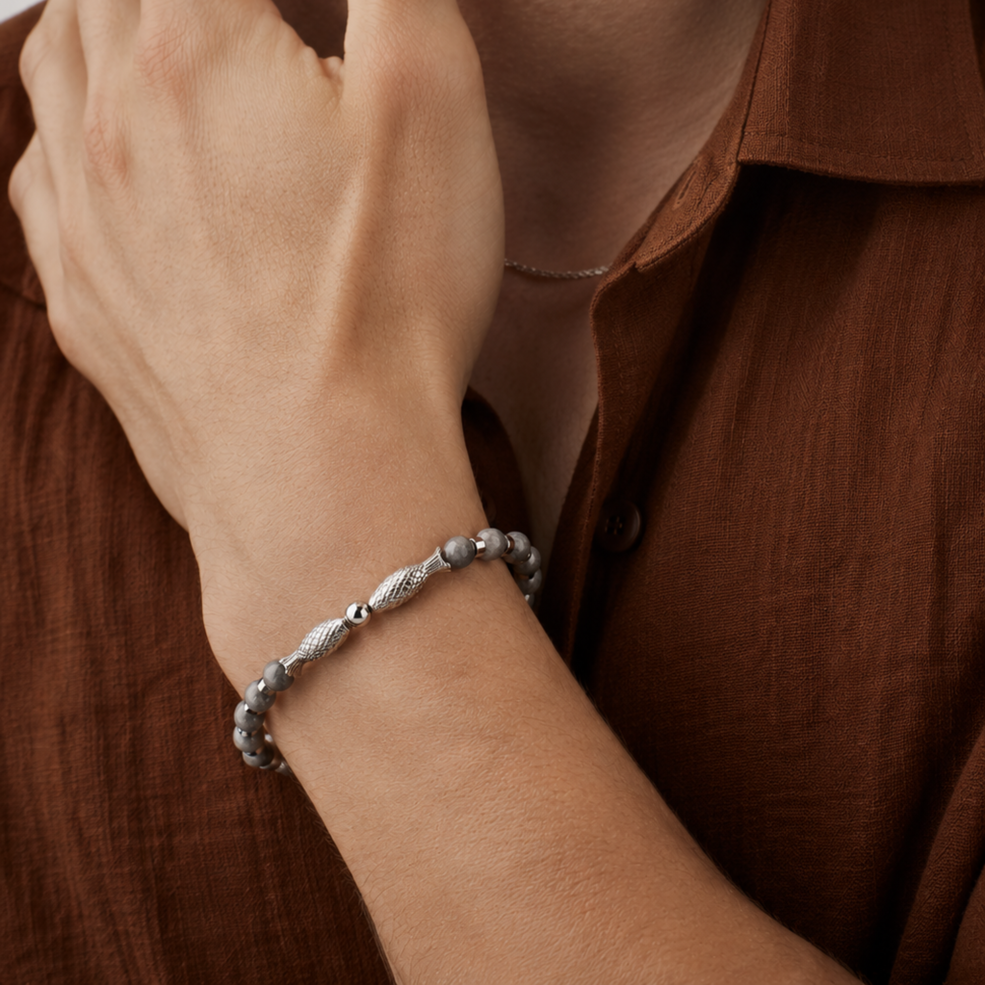 Twin Fish grey bracelet for men by SALVE featuring two fish-shaped charms on a sleek grey cord.