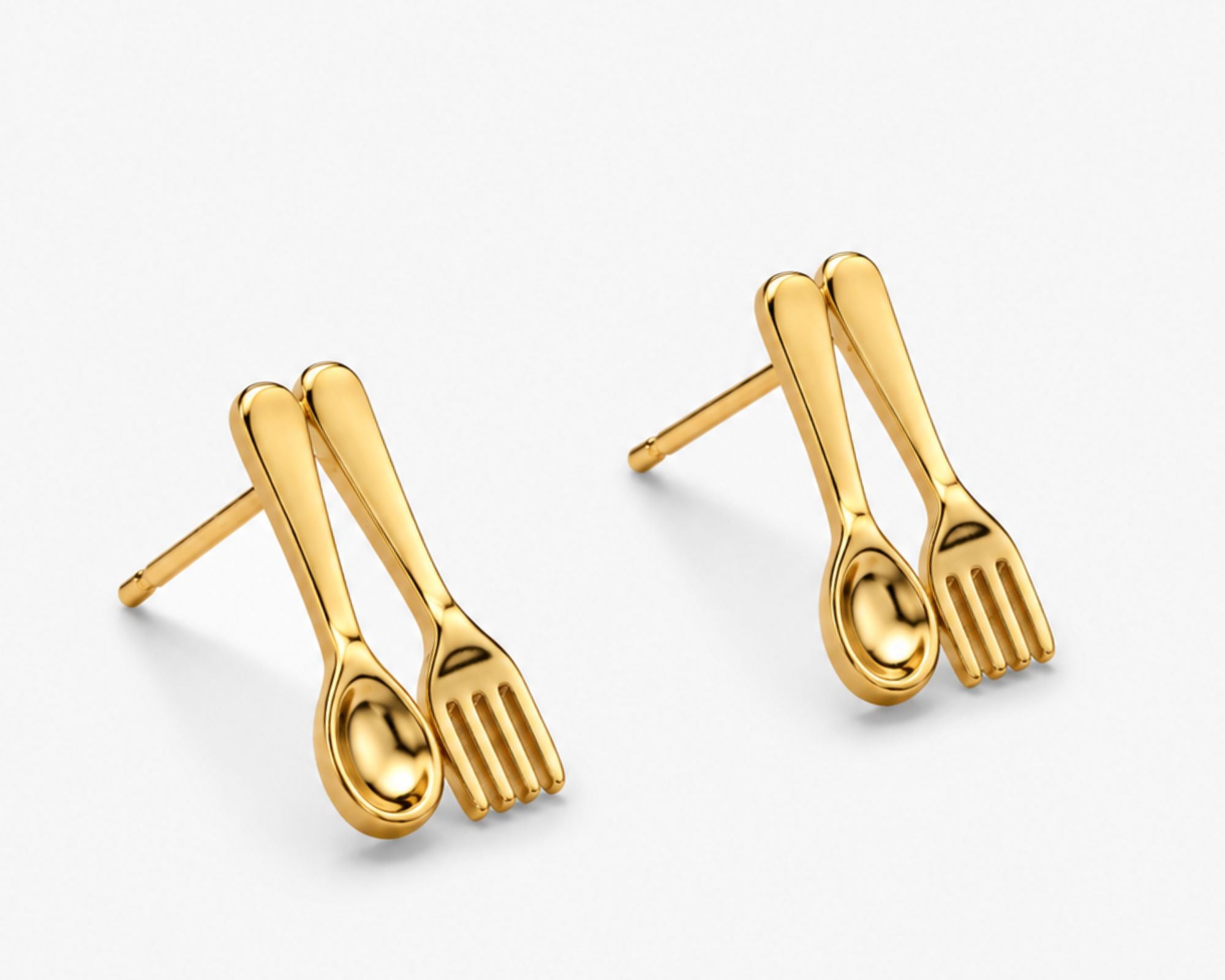 Salve Quirky Fork and Spoon earrings with silver-tone finish, featuring whimsical cutlery designs for a unique jewelry look.