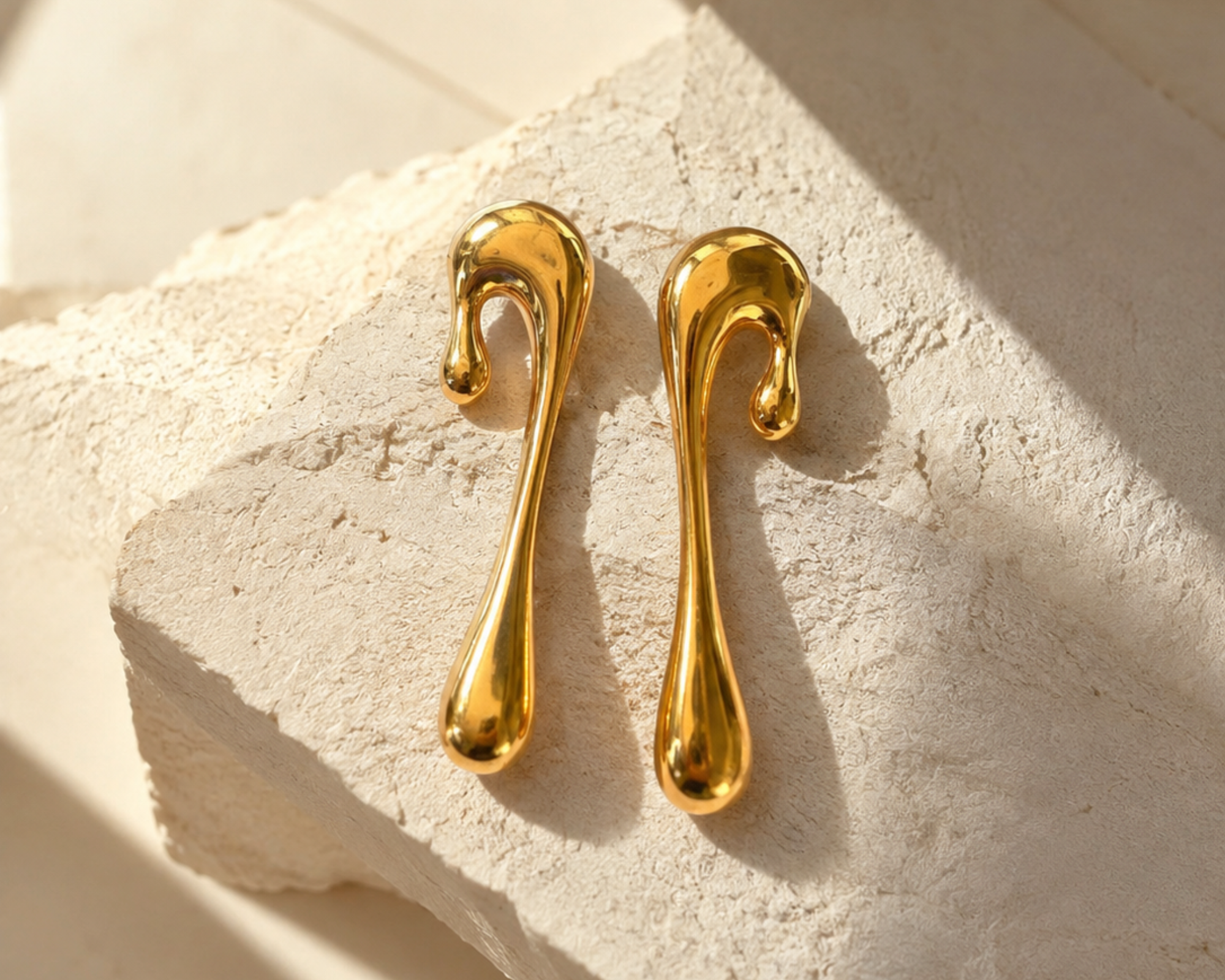 Salve chic abstract drop earrings featuring geometric shapes and modern design, hanging from silver hooks.