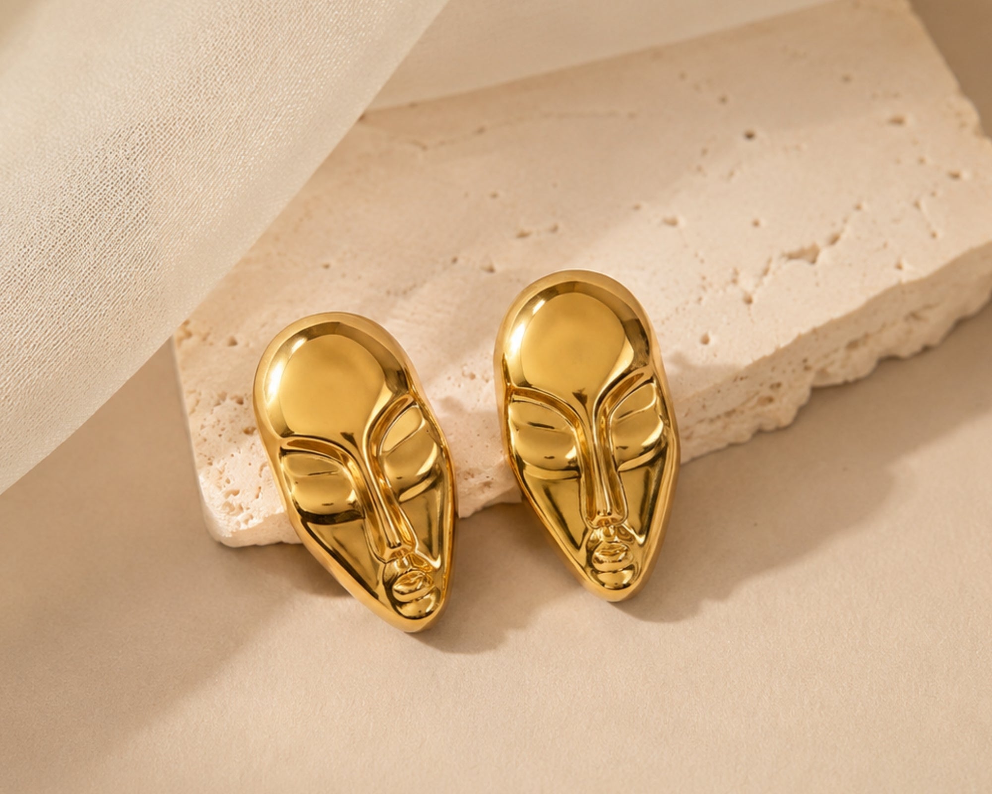 Gold statement face card stud earrings by SALVE featuring bold, modern design with a polished finish.