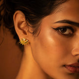 Salve Evil Eye Sunburst Stud Earrings featuring vibrant blue and gold sunburst design on silver studs.