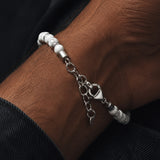 White Howlite bracelet for men featuring smooth white beads from SALVE, stylish and casual accessory.