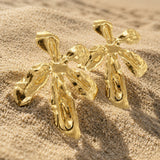 SALVE big statement flower earrings featuring bold floral design and vibrant colors, perfect for making a fashionable statement.