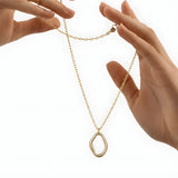 Abstract Gold-toned Pendant Necklace