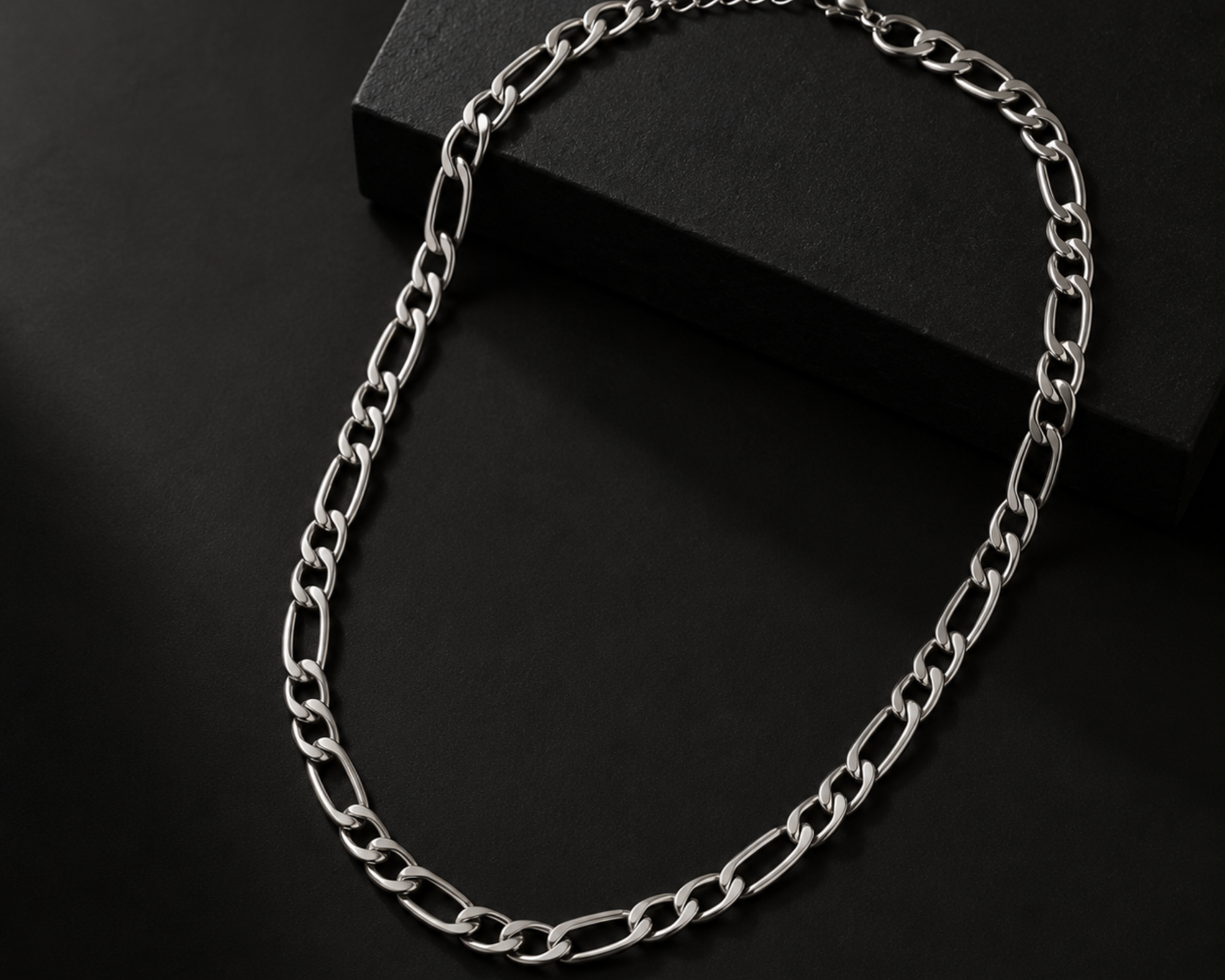 Stainless steel Figaro chain necklace for men with interlocking links, featuring a sleek, polished finish by SALVE.
