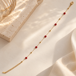 Red crystal anti-tarnish bracelet by SALVE featuring vibrant red crystals and a sleek bracelet design.