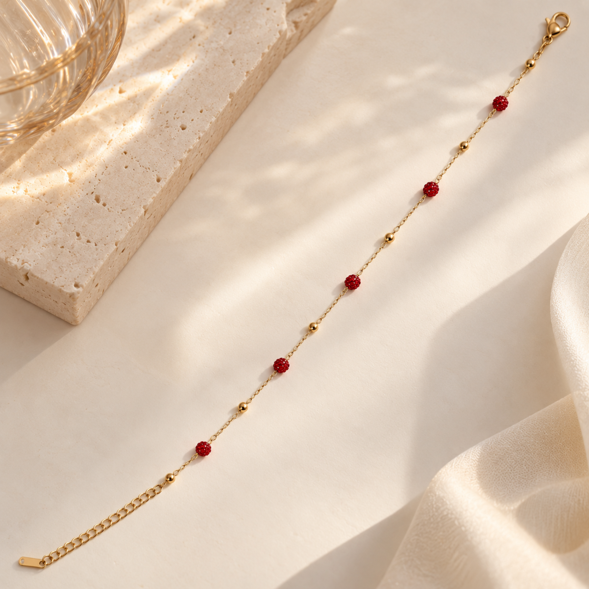 Red crystal anti-tarnish bracelet by SALVE featuring vibrant red crystals and a sleek bracelet design.