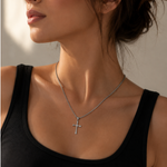 Silver-toned cross pendant necklace from SALVE featuring a detailed cross design on a sleek chain.