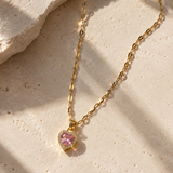 Salve CZ baby pink heart pendant necklace with a silver chain, featuring a sparkling pink heart charm.