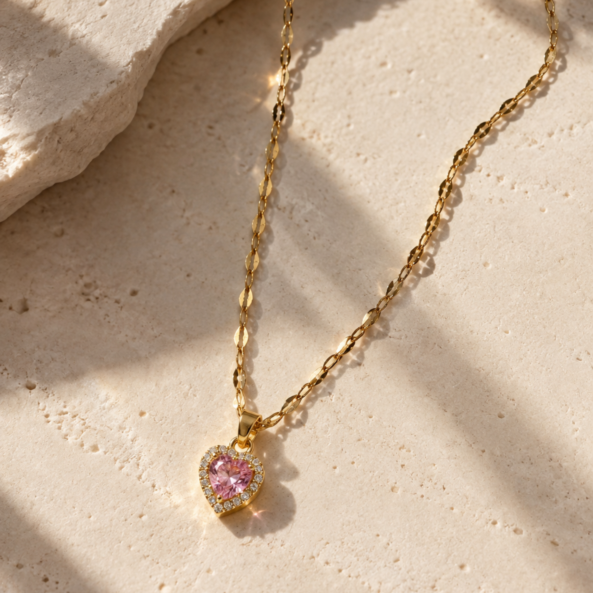Salve CZ baby pink heart pendant necklace with a silver chain, featuring a sparkling pink heart charm.