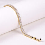 SALVE Baguette Stone Tennis Bracelet featuring sparkling baguette-cut stones on a delicate silver chain.