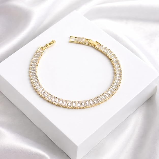 Salve Baguette Stone Tennis Bracelet featuring sparkling rectangular stones and a sleek silver chain design.