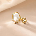 Salve Baroque faux pearl open adjustable ring featuring a large pearl centerpiece and delicate silver band.