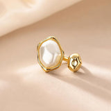 Salve Baroque faux pearl open adjustable ring featuring a large pearl centerpiece and delicate silver band.