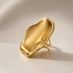 Adjustable SALVE Sculpted Statement Finger Ring with unique textured design on a neutral background.