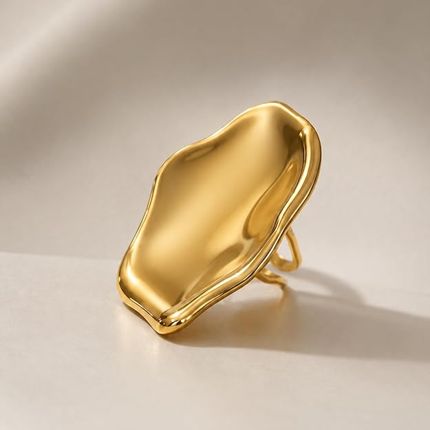 Adjustable SALVE Sculpted Statement Finger Ring with unique textured design on a neutral background.