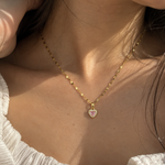 Salve CZ baby pink heart pendant necklace with sparkling gemstone on a silver chain, elegant jewelry accessory.