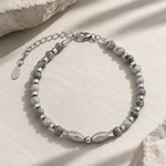 Salve Twin Fish Grey bracelet for men with two fish charms on a braided cord, stylish accessory for men's jewelry.