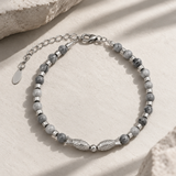 Salve Twin Fish Grey bracelet for men with two fish charms on a braided cord, stylish accessory for men's jewelry.