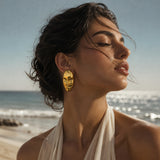 Gold SALVE Face Card statement stud earrings with intricate design, showcasing elegant jewelry for stylish accessories.
