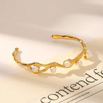 Salve faux pearl inlaid cuff bracelet featuring elegant design and silver-tone finish, displayed on a neutral background.