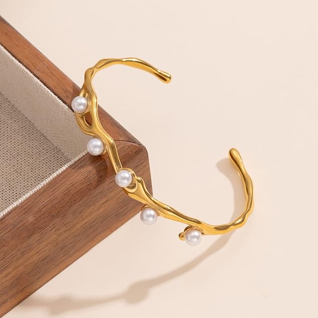 SALVE faux pearl inlaid cuff bracelet with silver-tone metal design, featuring elegant pearl accents on a wide bracelet band.
