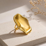 Adjustable SALVE Sculpted Statement Finger Ring with bold, artistic design on a neutral background.