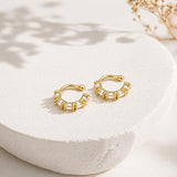 Salve No Piercing CZ Ear Cuffs earrings featuring sparkling cubic zirconia stones and a sleek silver-tone design.
