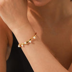 Faux pearl inlaid SALVE cuff bracelet with a sleek metallic band and elegant pearl accents for a stylish accessory.