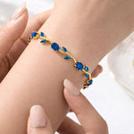 Blue Tulip Bracelet by SALVE featuring a delicate bracelet with blue tulip charm and elegant design.