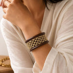 Salve chunky wooden bangle bracelet stack with natural wood tones and smooth, rounded design for stylish wrist accessories.
