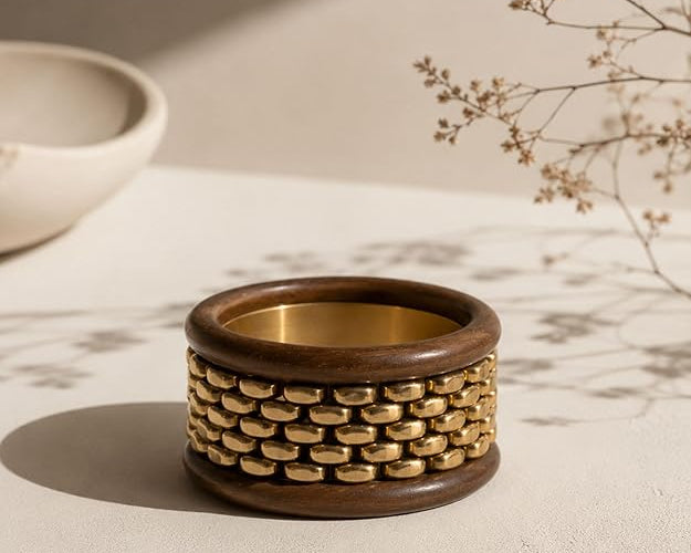 Stack of chunky wooden bangle bracelets from SALVE featuring natural wood textures and smooth, rounded design.