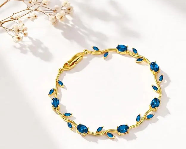 Blue Tulip bracelet by SALVE featuring a delicate floral design with blue tulip charms and silver accents.