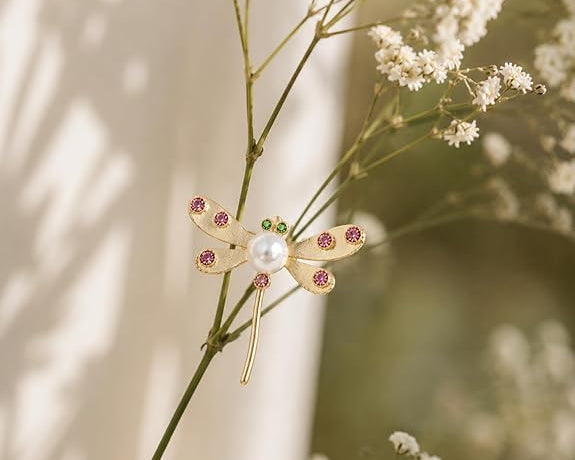 Salve Chic Dragonfly Brooch Pin featuring detailed metalwork and vibrant enamel accents, perfect for elegant accessories.