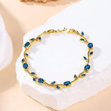 Blue Tulip bracelet by SALVE featuring a delicate design with blue tulip charms and adjustable chain.