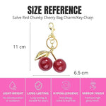 Red glitter cherry keychain from SALVE featuring shiny, sparkly red cherries with a silver keyring attachment.
