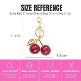 Red glitter cherry keychain from SALVE featuring shiny, sparkly red cherries with a silver keyring attachment.