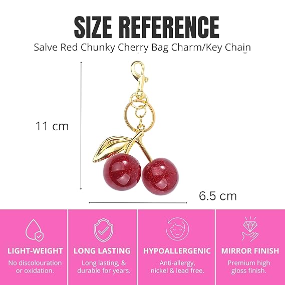 Red glitter cherry keychain from SALVE featuring shiny, sparkly red cherries with a silver keyring attachment.