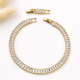 Salve Baguette Stone Tennis Bracelet showcasing sparkling rectangular gemstones on a delicate silver chain.
