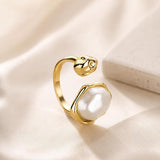 Adjustable SALVE Baroque faux pearl open ring featuring a luminous pearl centerpiece on a sleek metal band.